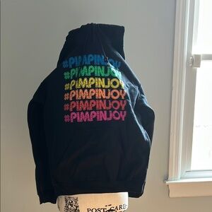 Pimpinjoy Black Hoodie with Colorful text from The Shop Forward